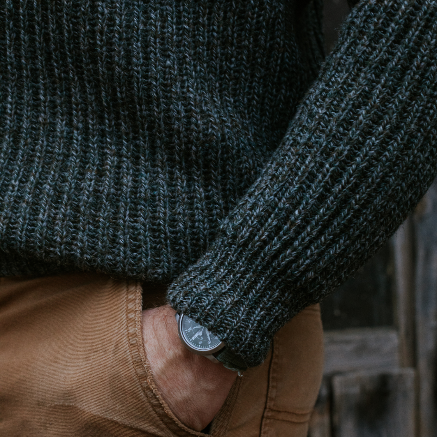 British wool sweater in heathered green - ribbed with suede shoulder patches. Heavyweight wool. Extremely warm. Close up. 