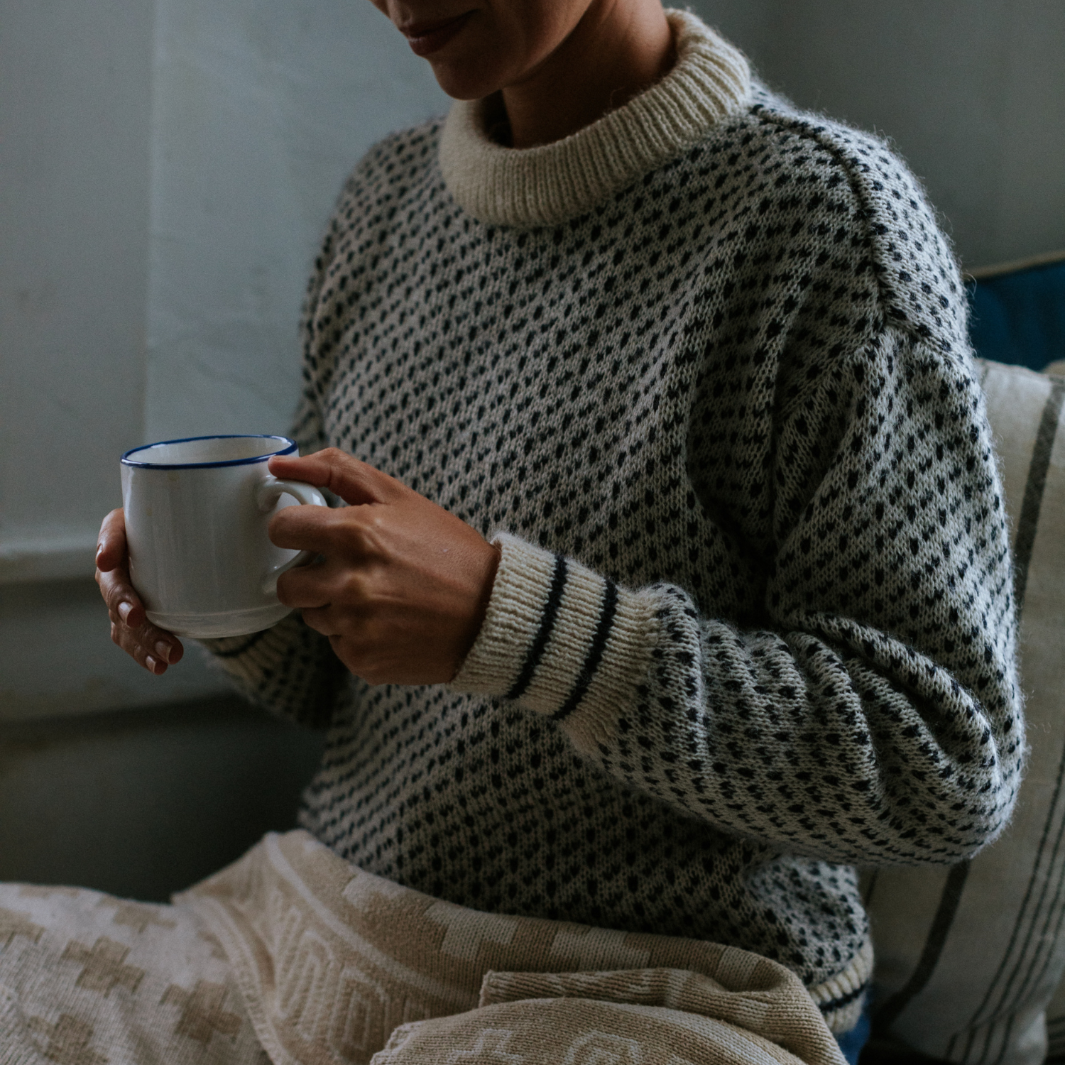 British wool nordic style fisherman sweater in white - ragg wool / birdseye style - on female model size extra small