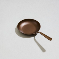 Carbon steel little farmhouse skillet on white background 