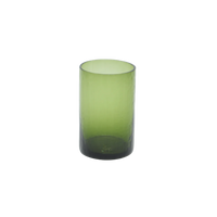 Green glass tumbler on a white background