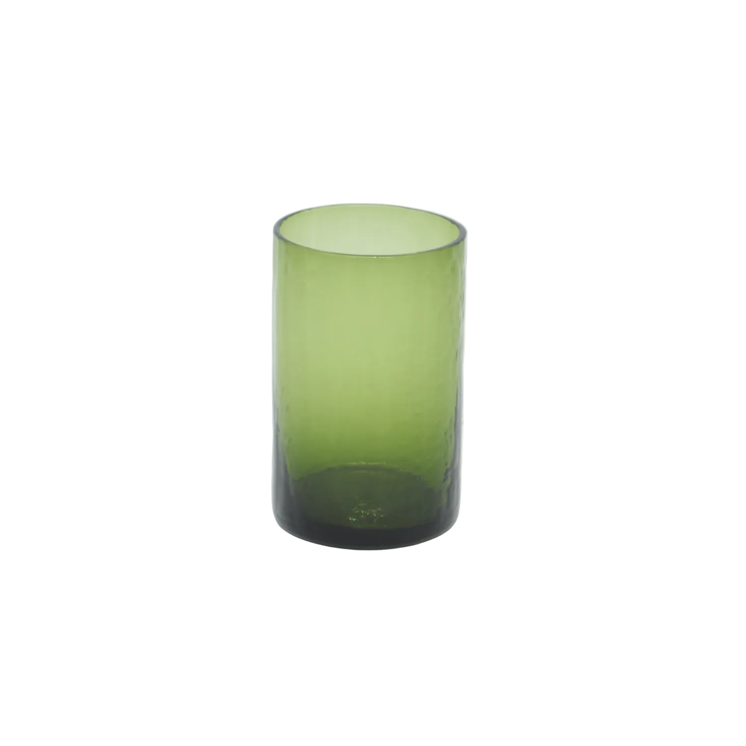 Green glass tumbler on a white background