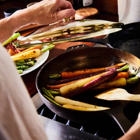 Smithey cast iron no. 11 pan with lid cooking vegetables