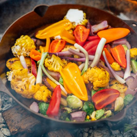 Smithey No. 14 Farmhouse Skillet on open flame