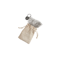 Chainmail scrubber in a drawstring bag on a white background